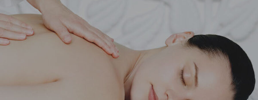 woman lying on white table. Massage therapy