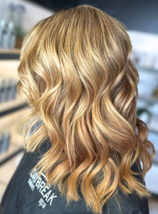 Blond wavy long hair with dimensional highlights